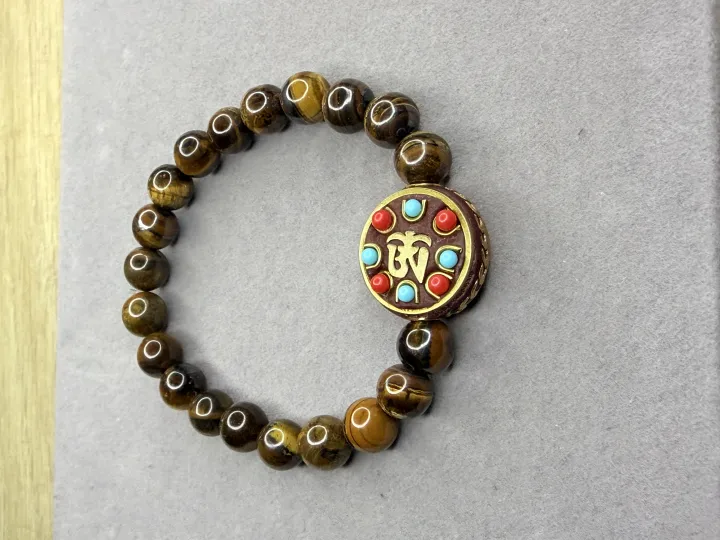 Pulsera Ojo de Tigre + Dije Tibetano