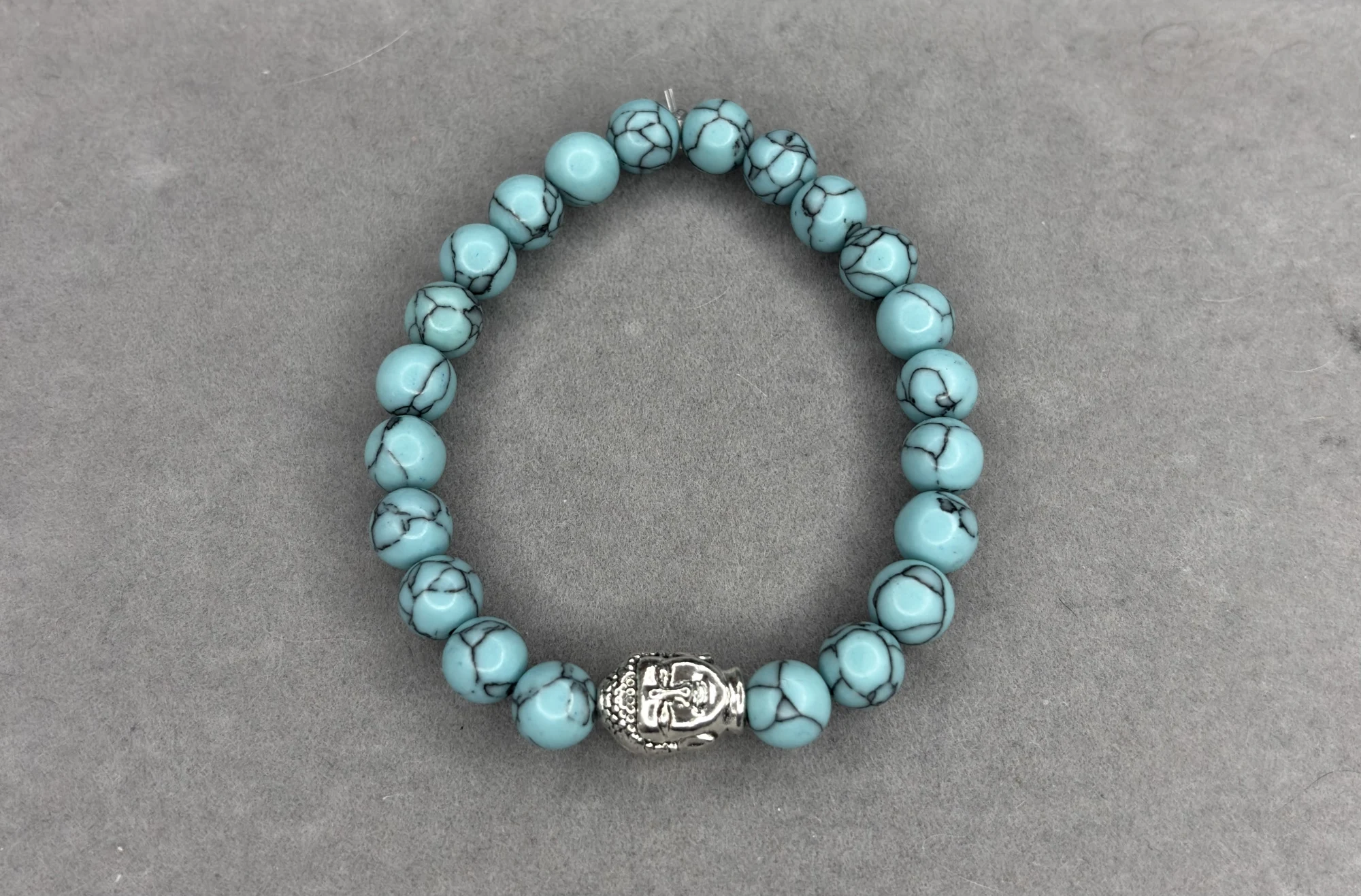 Pulsera turquesa con dije de Buda