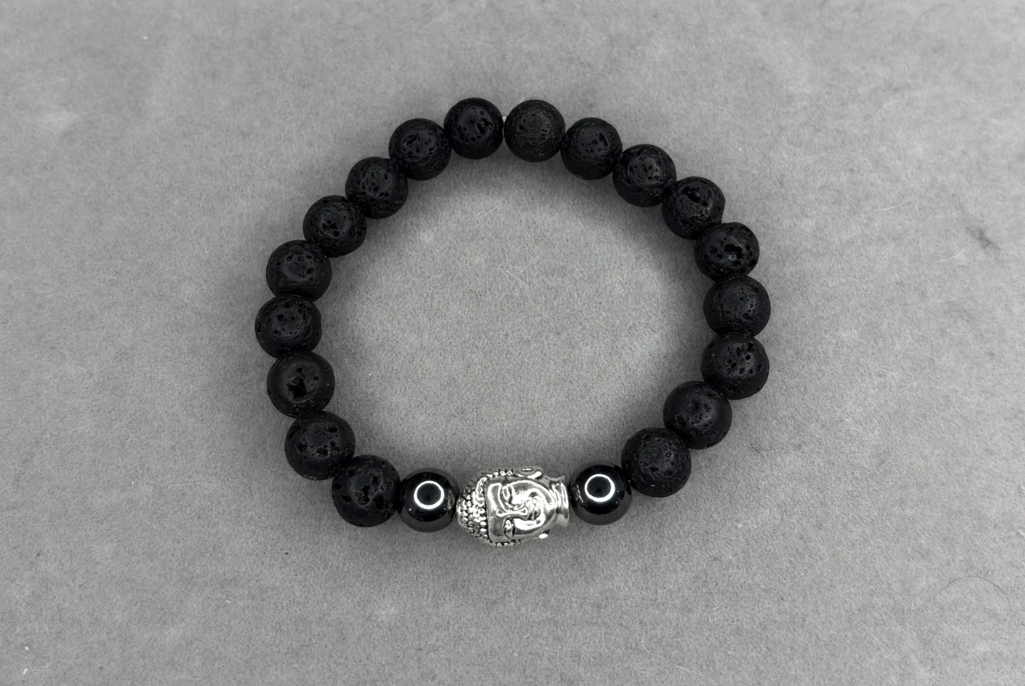Pulsera piedra volcánica + hematita y dije Buda