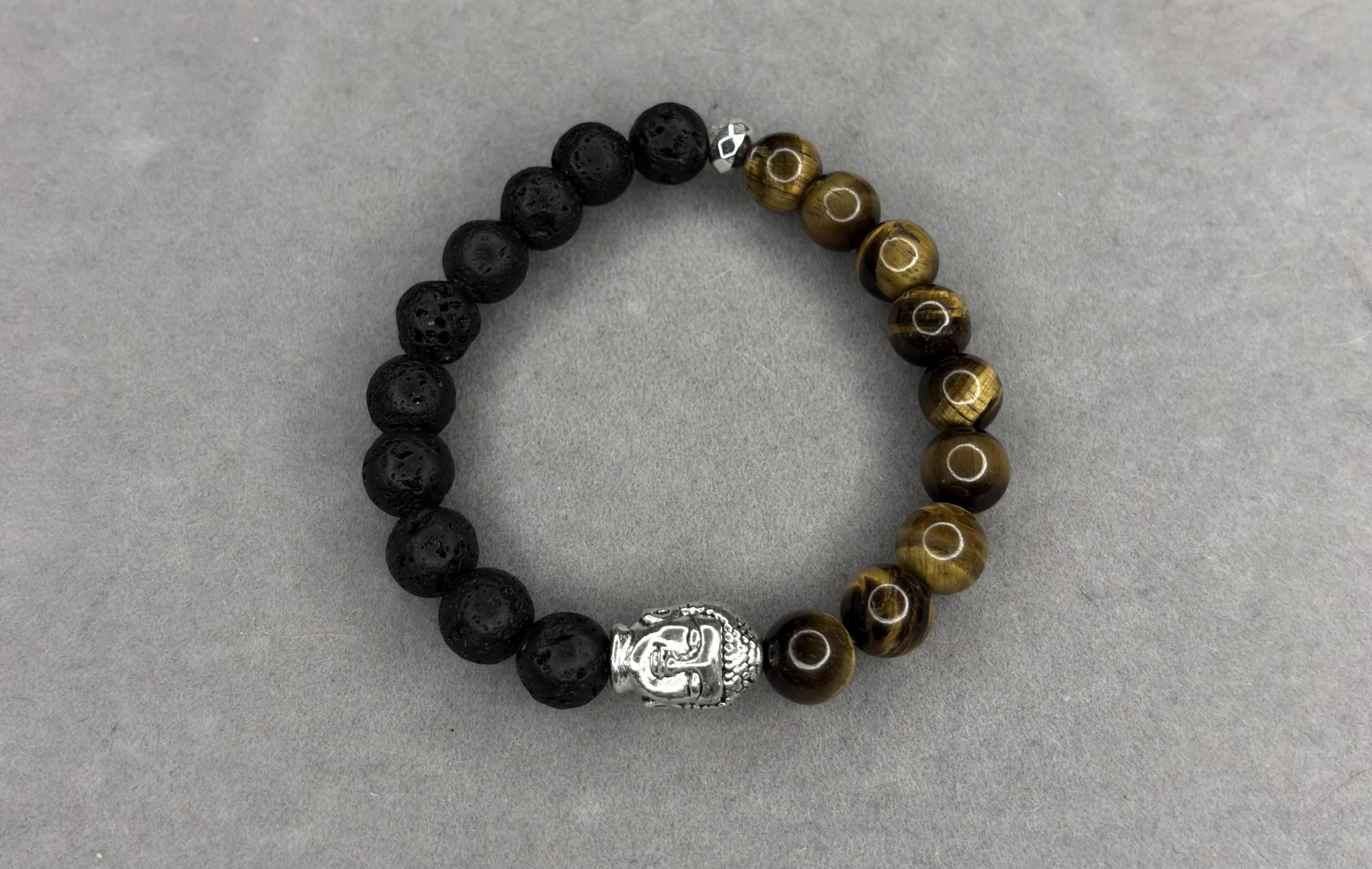 Pulsera piedra volcánica + ojo de tigre y dije Buda