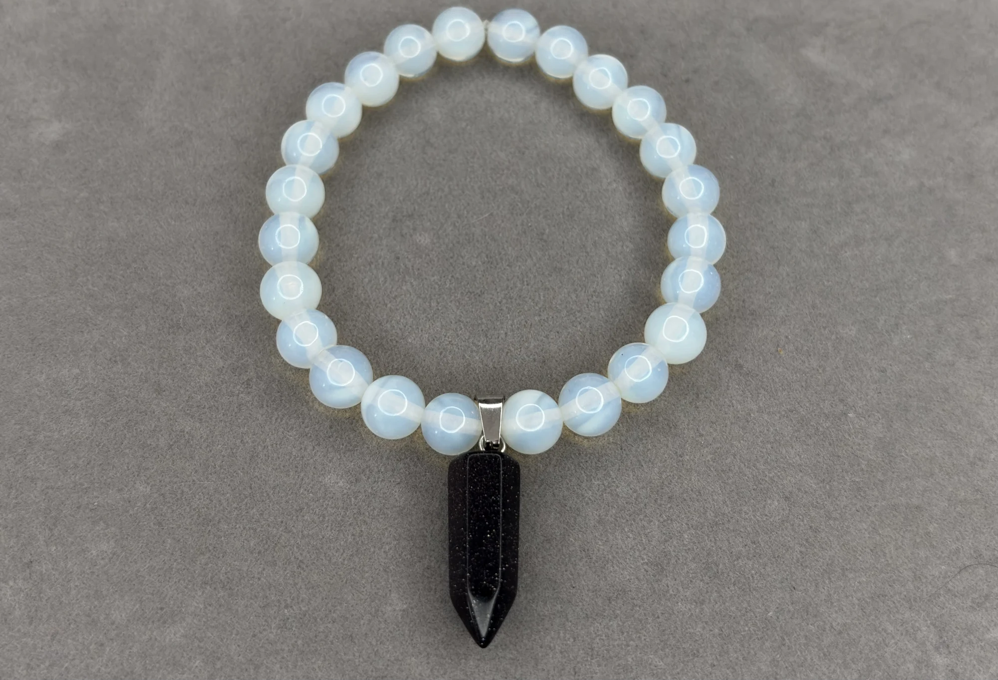 Pulsera Ópalo + dije lluvia de plata