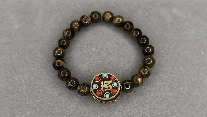 Pulsera Ojo de Tigre + dije Tibetano