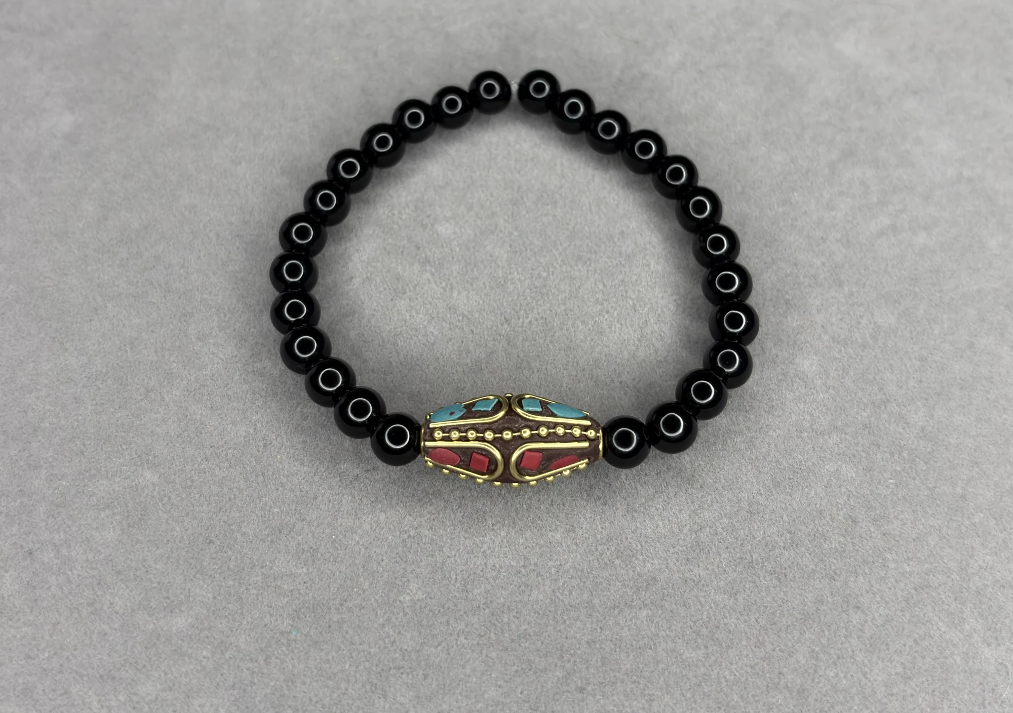 Pulsera Ónix + Dije Tibetano