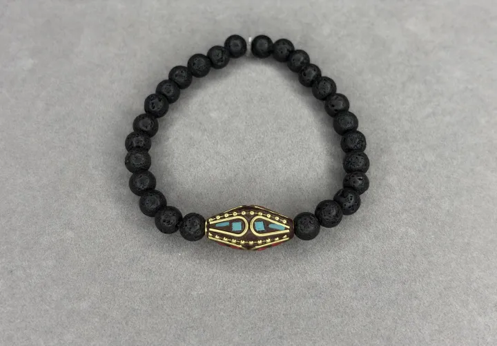 Pulsera Piedra Volcánica + Dije Tibetano