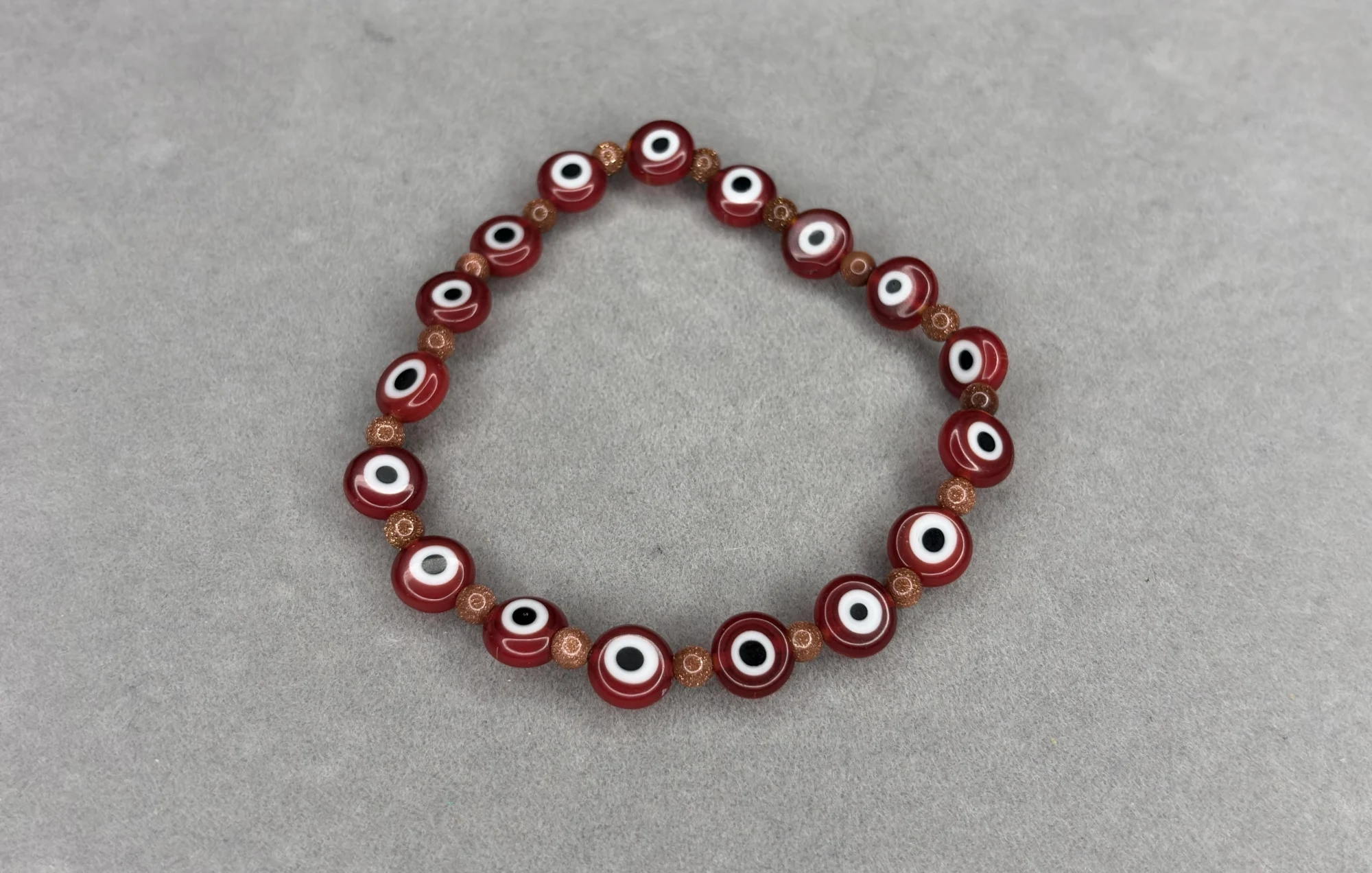 Pulsera Lluvia de Oro + Ojos Turcos Rojos